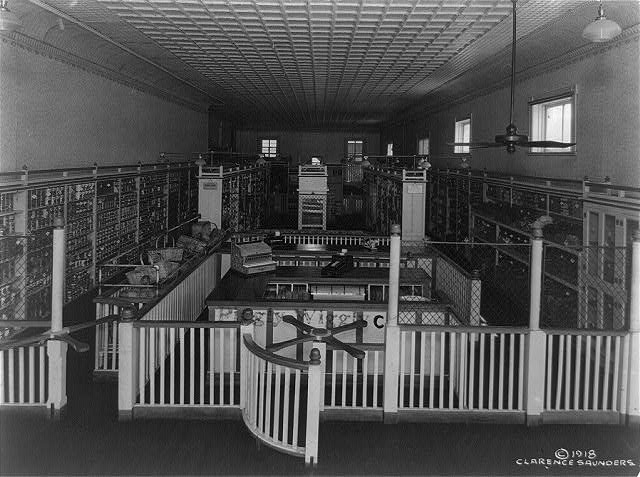 Interior of a Piggly Wiggly grocery store, Memphis, Tennessee, c.1918. The shelf is bare and the manager doesn't see what the fuss is about.